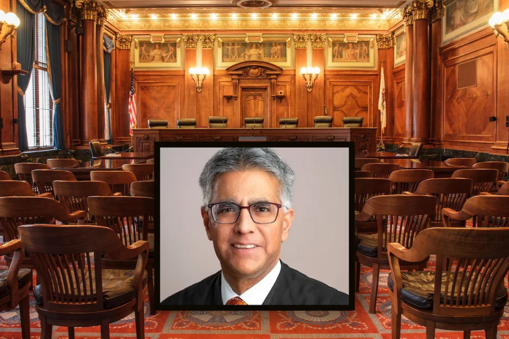 A Cook County, Illinois courtroom with a judge seated at the bench while attorneys stand at counsel tables, natural indoor lighting, news photography style