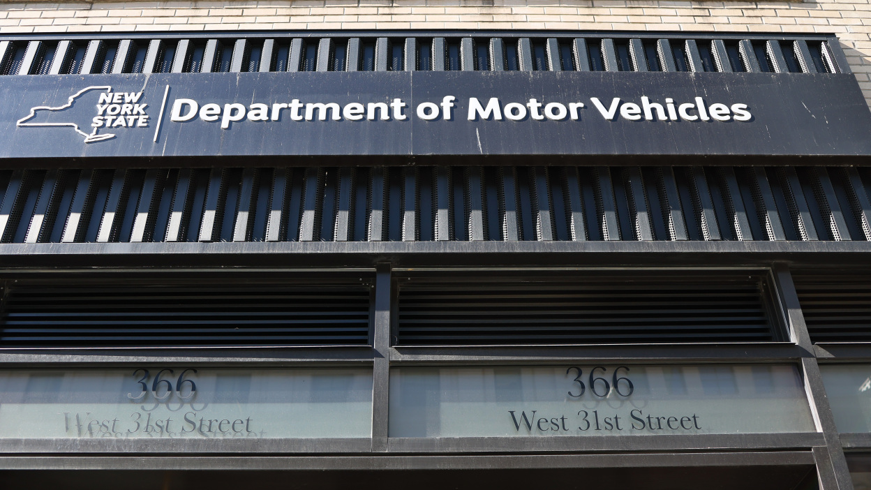 A Department of Motor Vehicles office sign outside a public building