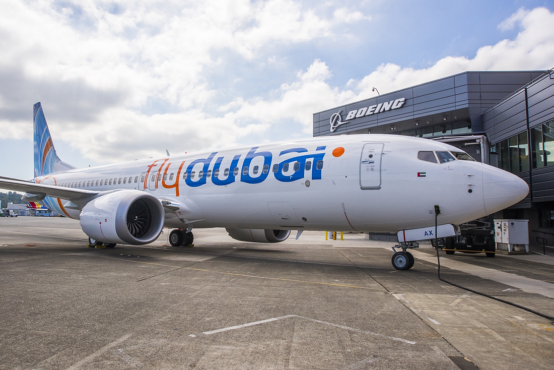 A Flydubai Boeing 737-8 MAX aircraft in flight, photographed from the ground