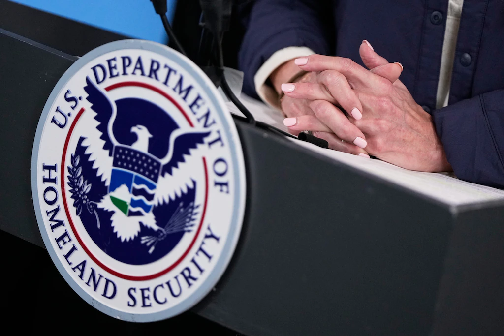 A U.S. Citizenship and Immigration Services sign outside a federal facility