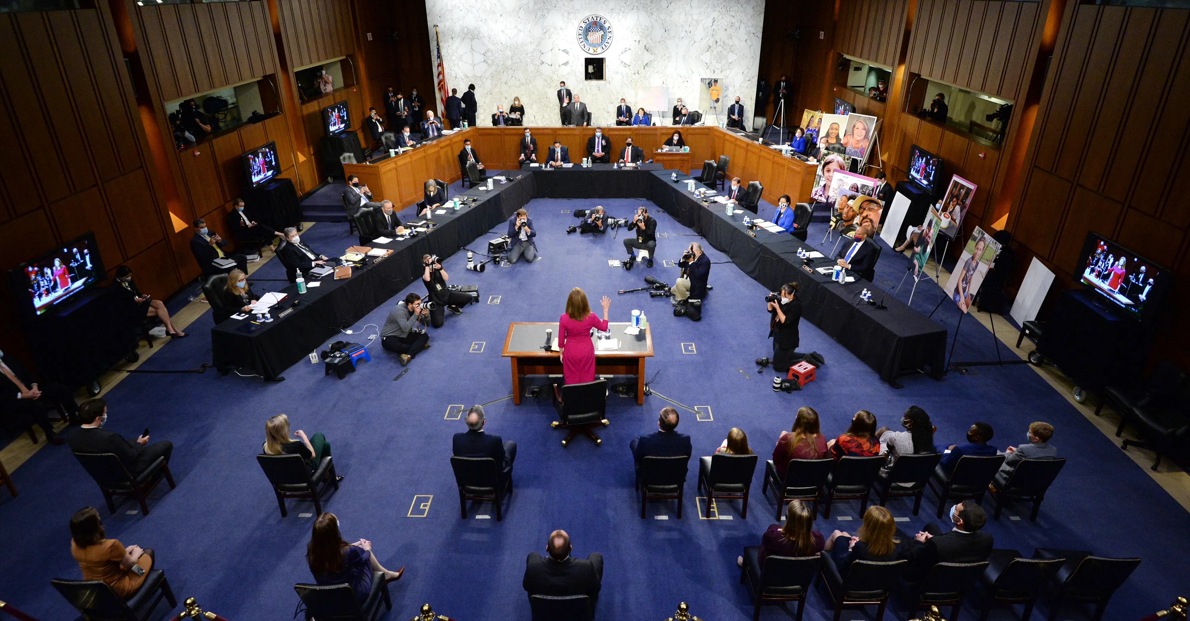 A U.S. Senate committee room during a judicial confirmation hearing, with senators seated at the dais and a nominee at a witness table