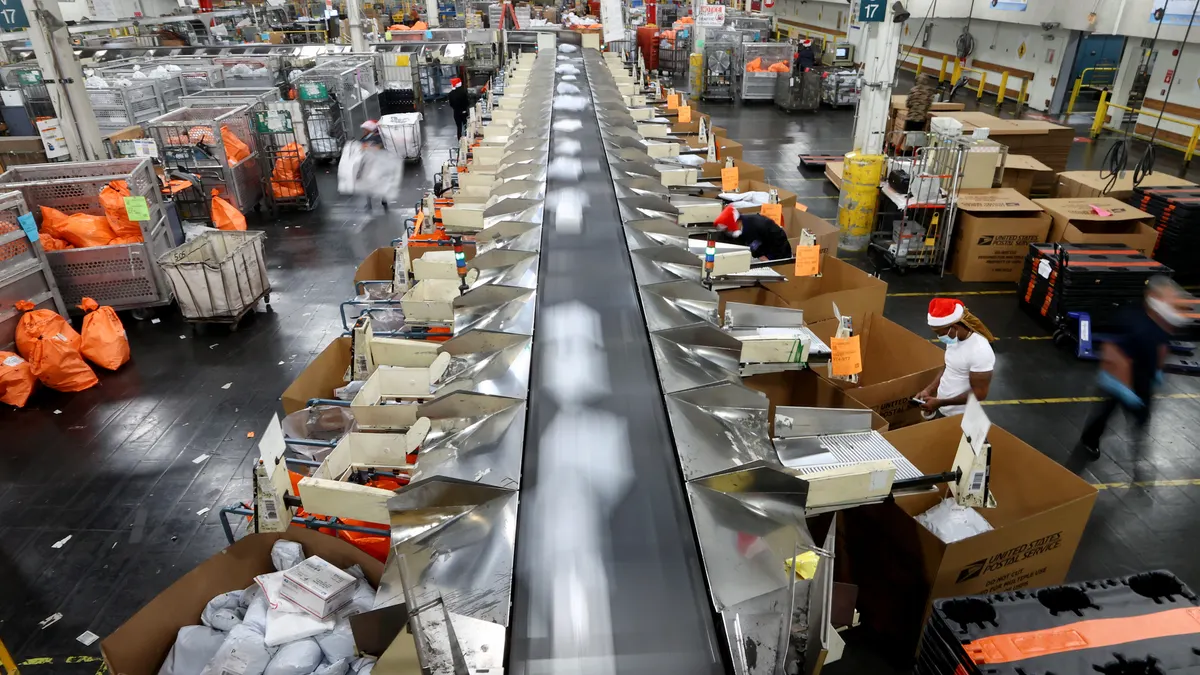 A United States Postal Service processing facility where mail is sorted and handled, illustrating the real-world logistics that intersect with mail-in voting