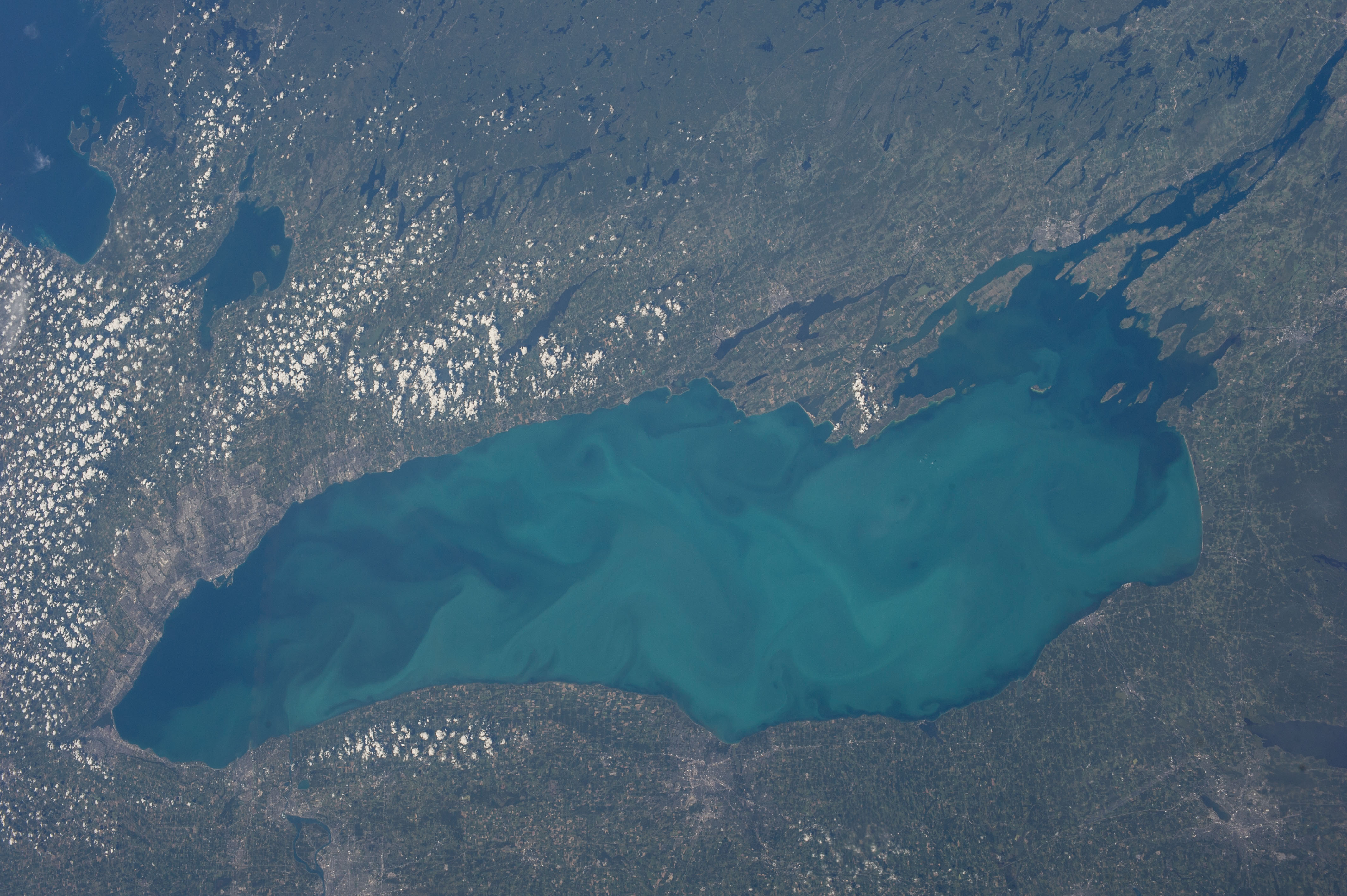 A border-related marker or signage near the Lake Ontario shoreline