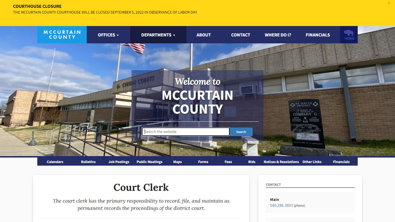 A busy county courtroom with multiple defendants seated in the gallery waiting for their cases to be called during a morning arraignment docket, realistic courtroom photo