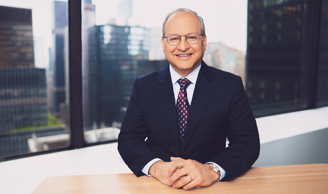 A candid news-style photograph of a bank compliance office in New York City in 2002, with staff working at desks reviewing transaction records on computer screens