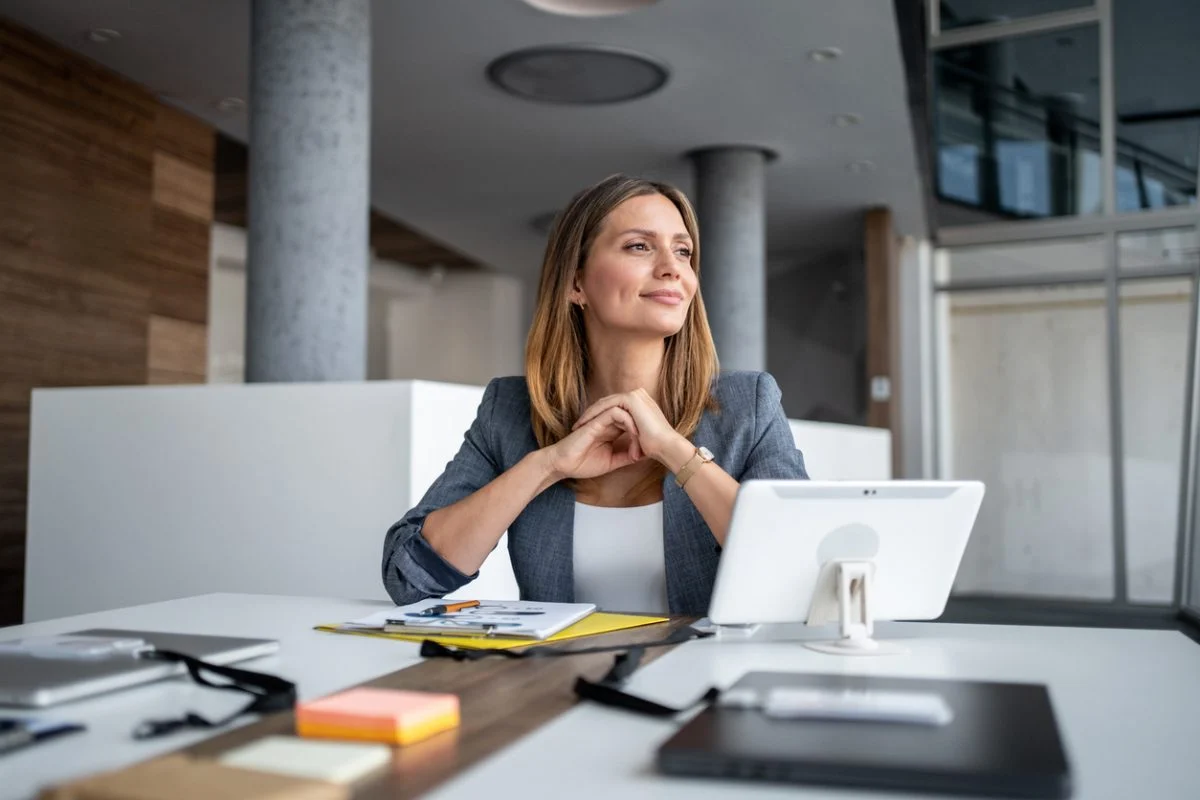 A civil litigator seated at a desk reviewing a thick case file with sticky notes, professional office photography style