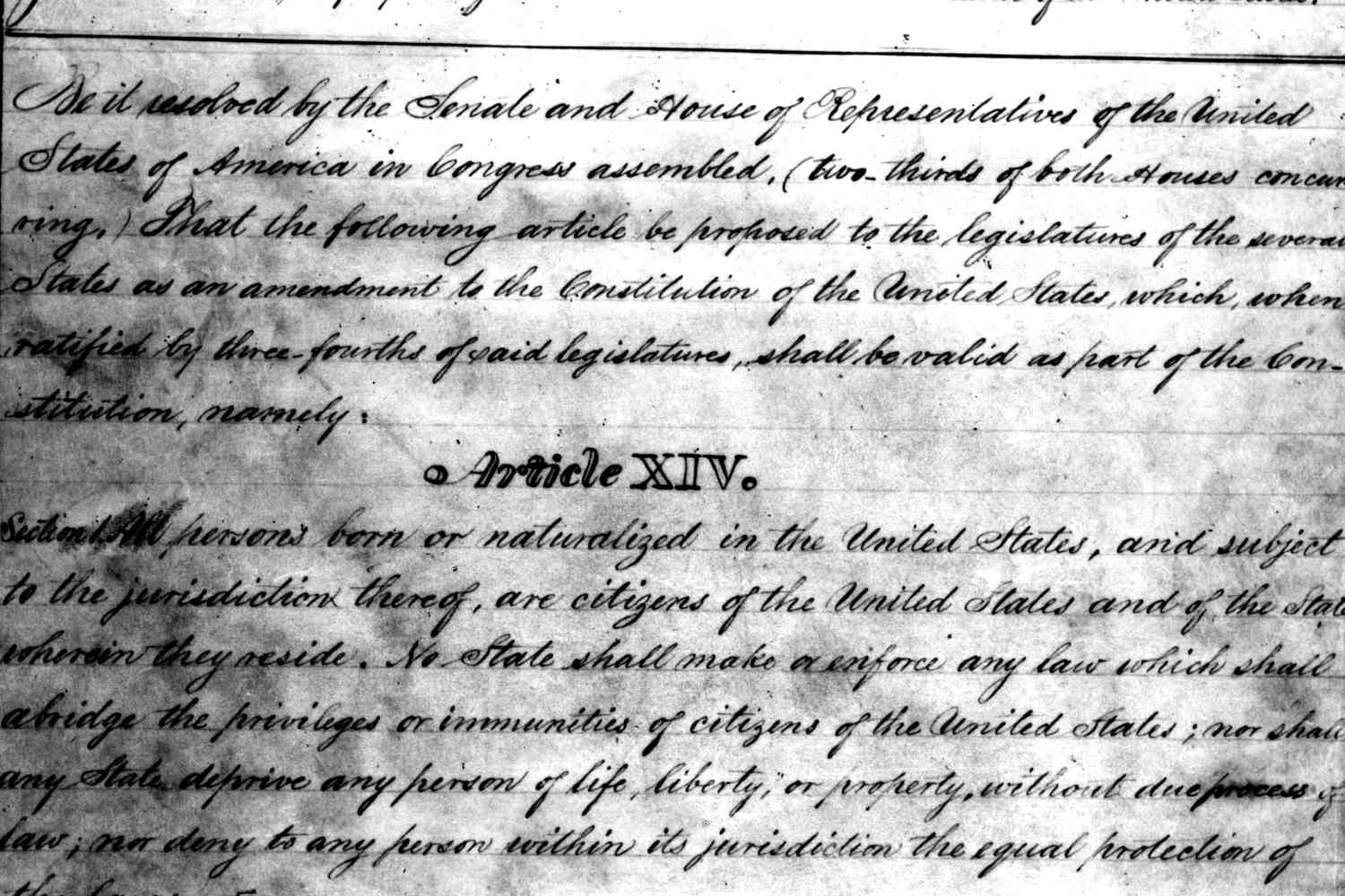 A close photograph of U.S. Constitution text showing the Fourteenth Amendment heading and printed clauses