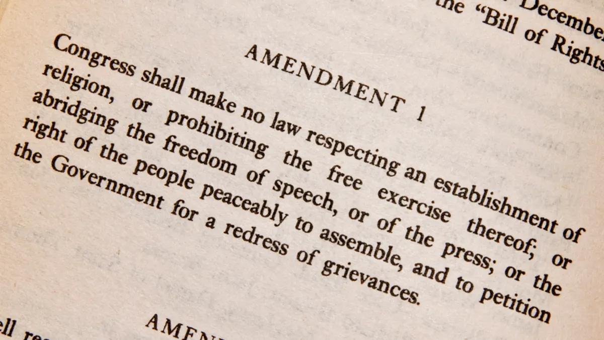 A close, readable photograph of the First Amendment text on the U.S. Constitution or Bill of Rights