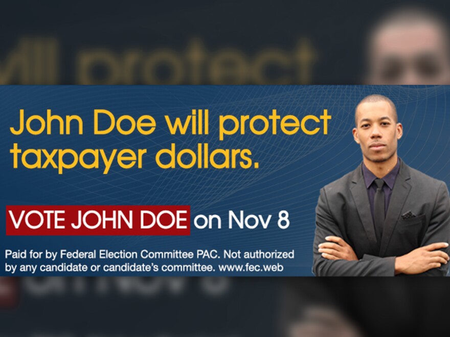 A close-up photograph of a television screen showing the small-print disclaimer line at the end of a political advertisement, shallow depth of field