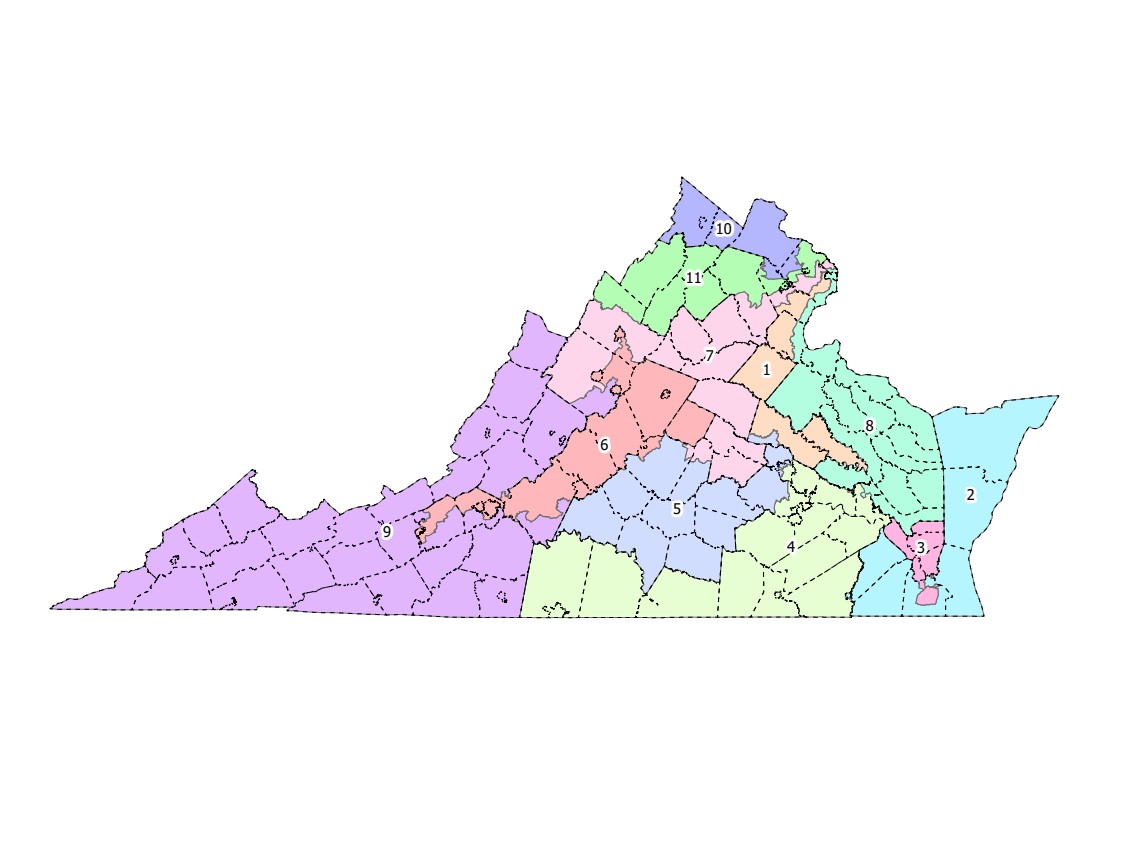 A close-up view of a congressional district map on a desk with notes and a pen nearby, documentary photo