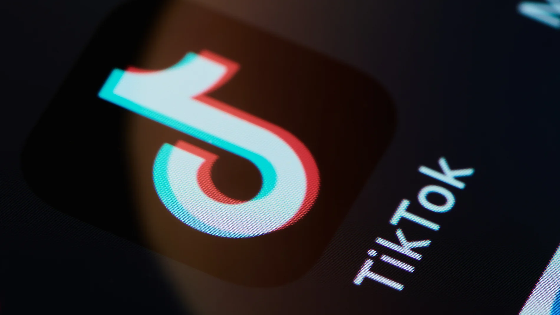 A close view of the TikTok app icon displayed on a smartphone screen