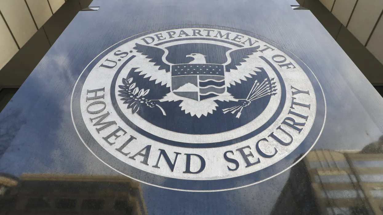A close view of the U.S. Department of Homeland Security seal on a wall, photographed in a realistic editorial style