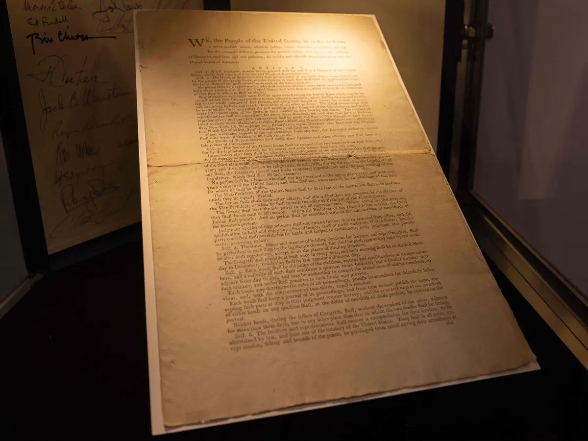 A close view of the United States Constitution document, highlighting the text that underpins Congress and presidential war powers