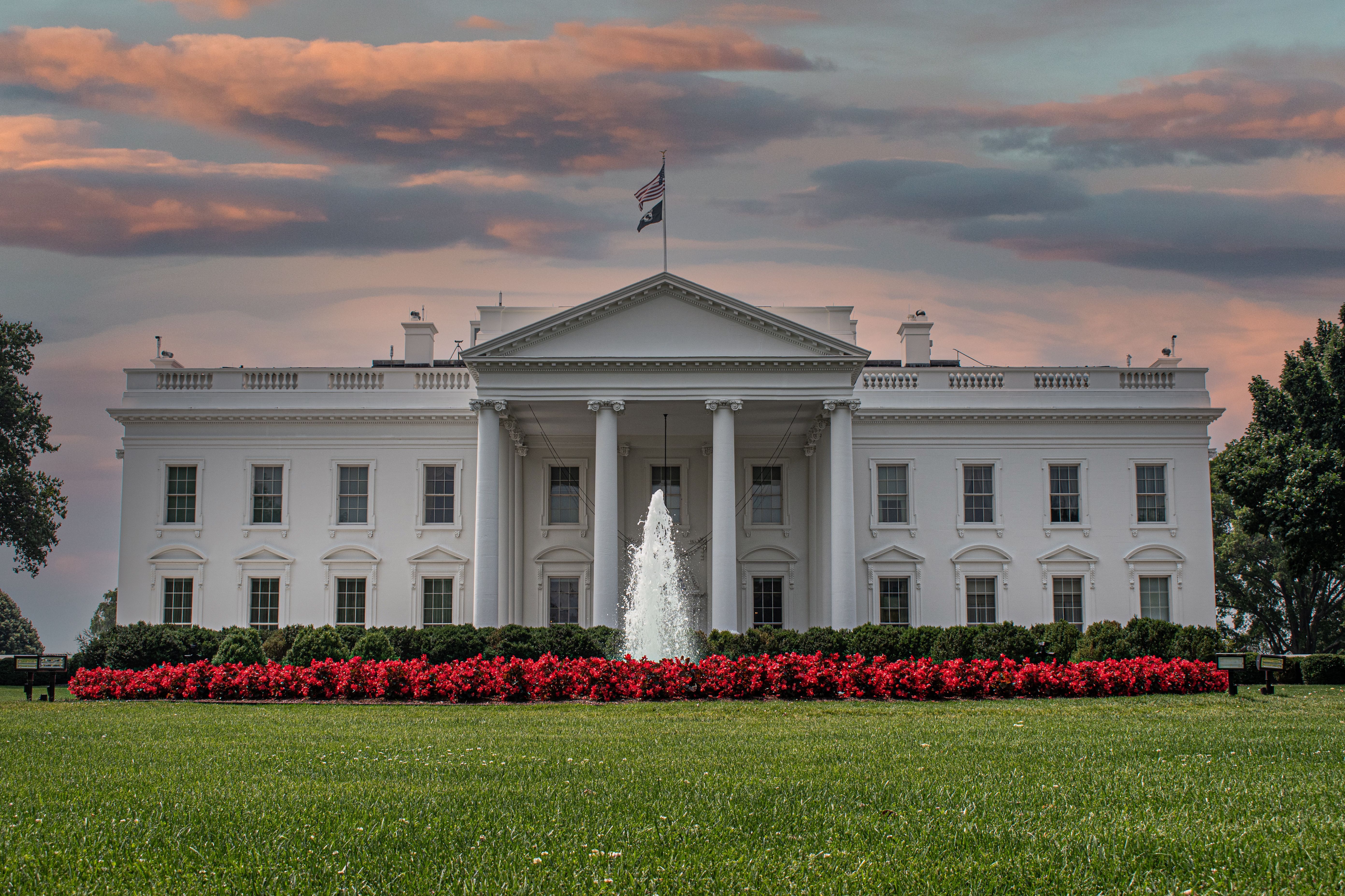 A daylight exterior photograph of the White House in Washington, D.C., viewed from the North Lawn