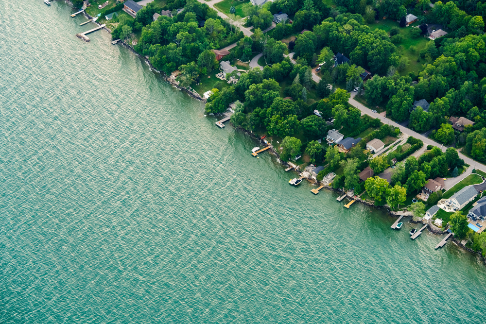 A daylight photograph of Lake Ontario from the Toronto waterfront, showing shoreline and open water