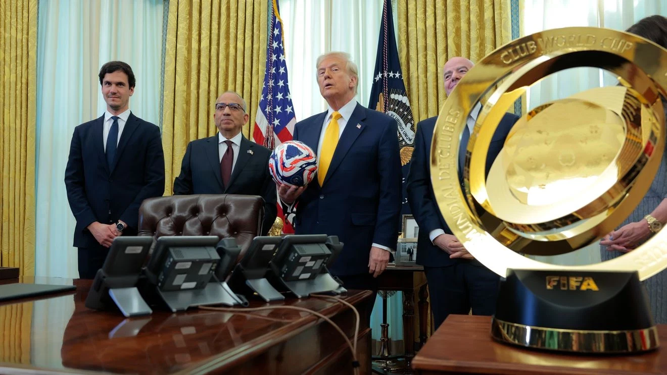 A formal diplomatic meeting in the Oval Office with the U.S. President seated across from foreign officials, photographers present, news photography style