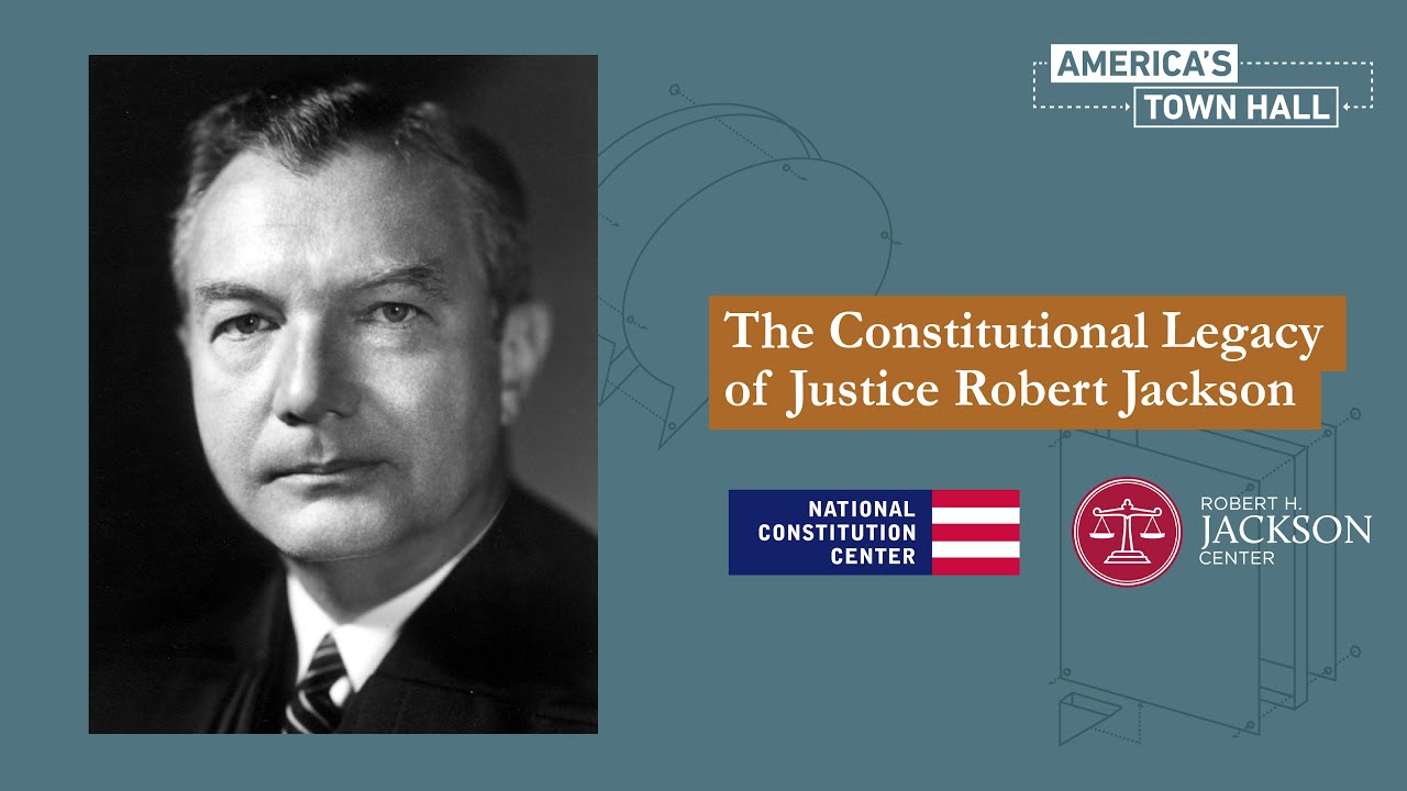 A formal photographic portrait of Justice Robert H. Jackson in judicial robes, seated indoors with a neutral background, documentary photography style