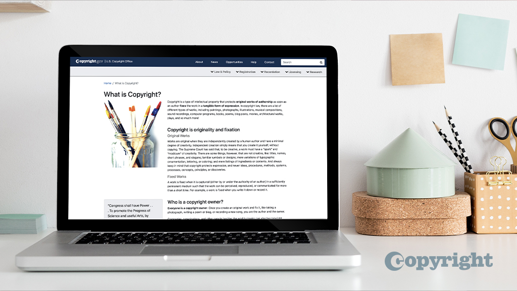 A laptop on a wooden desk displaying the Regulations.gov website with a person’s hands near the keyboard, natural light, realistic photography