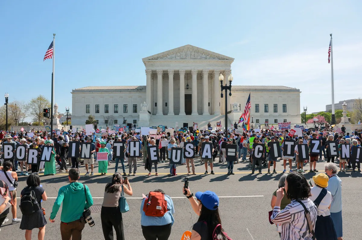 A line of journalists and TV cameras set up outside the United States Supreme Court building, real news photo style