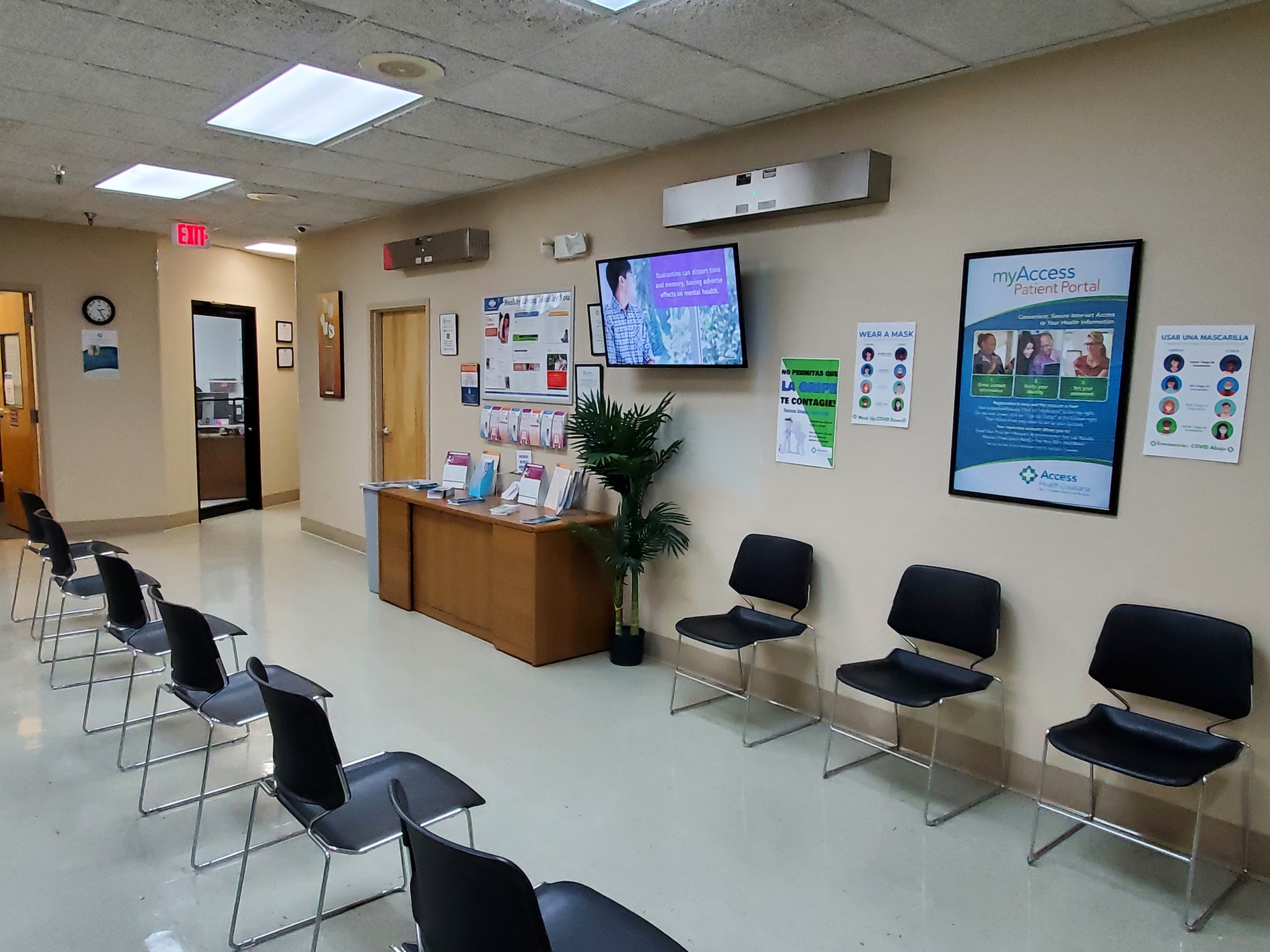 A line of people waiting in a public assistance office waiting area in the United States, documentary news photography style