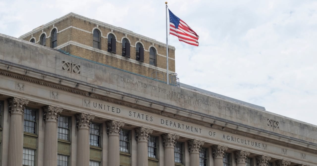 A photograph of a U.S. Department of Agriculture Food and Nutrition Service office exterior or building signage