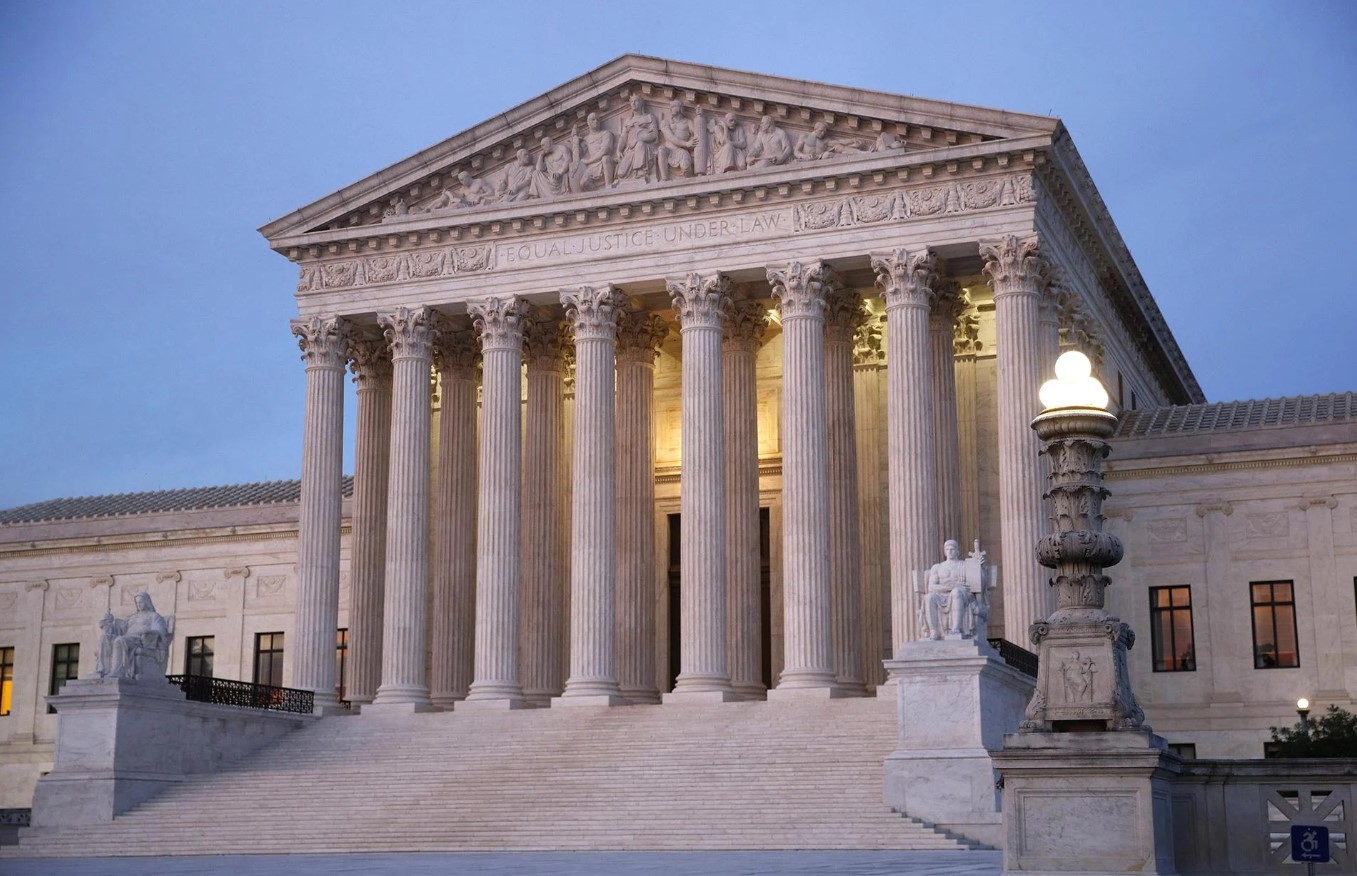 A photograph of a historical document or printed page referencing the 1869 law that set the Supreme Court at nine justices
