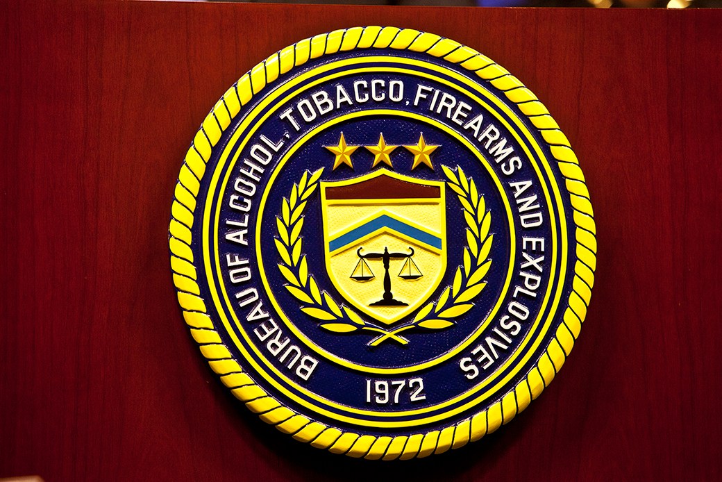 A photograph of an ATF facility or building signage associated with the Bureau of Alcohol, Tobacco, Firearms and Explosives