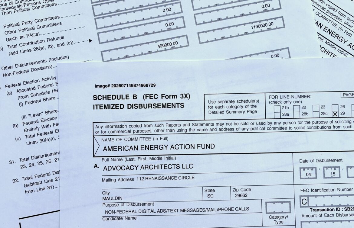 A photograph of printed federal campaign-finance disclosure paperwork, such as an FEC Form 3X filing, laid out for review