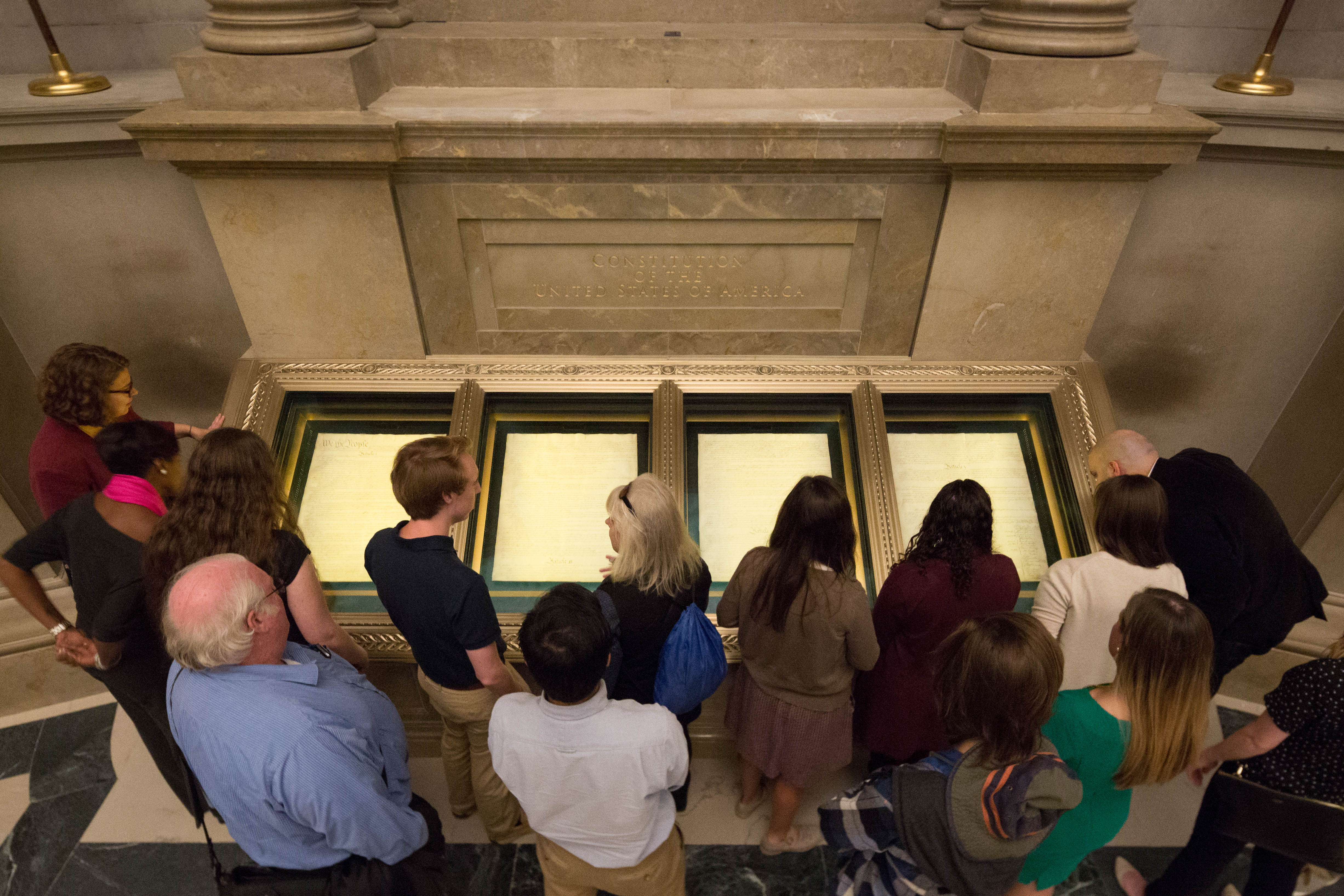 A photograph of the Twenty-Sixth Amendment exhibit at the U.S. National Archives, showing the amendment text in a formal display