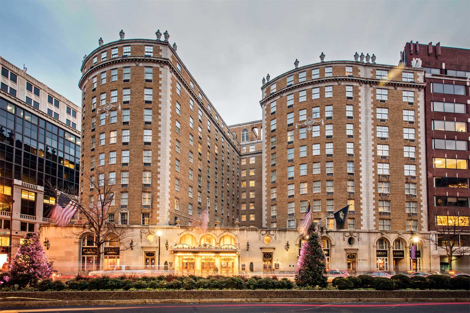 A real exterior photograph of the Mayflower Hotel in Washington, D.C., taken from street level