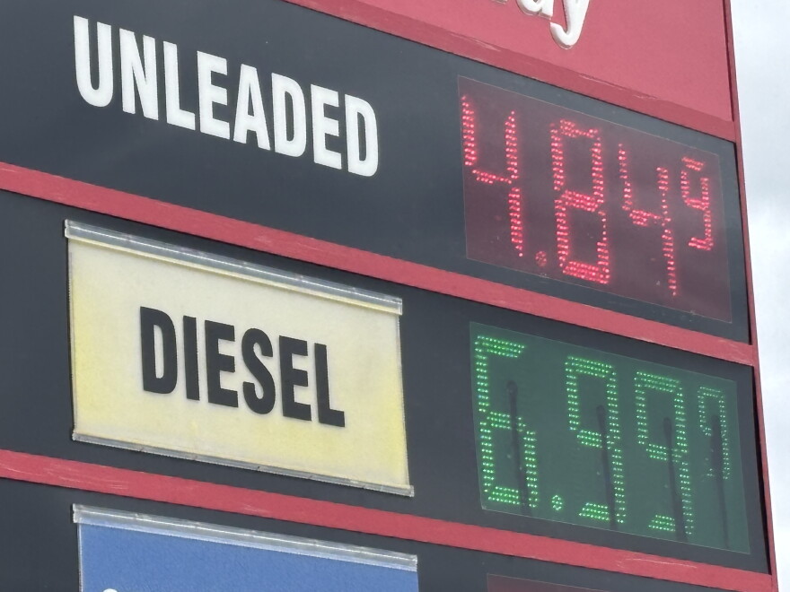 A roadside gas station price sign showing gasoline and diesel prices