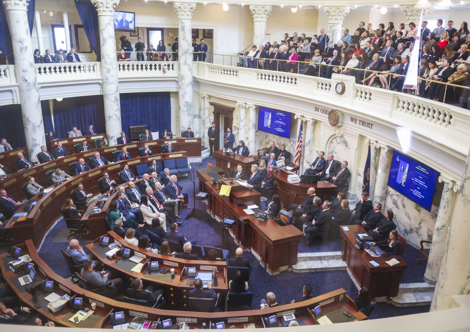 A wide-angle photograph of the United States Senate chamber with senators seated at desks during a legislative session, Washington, DC, news photography style