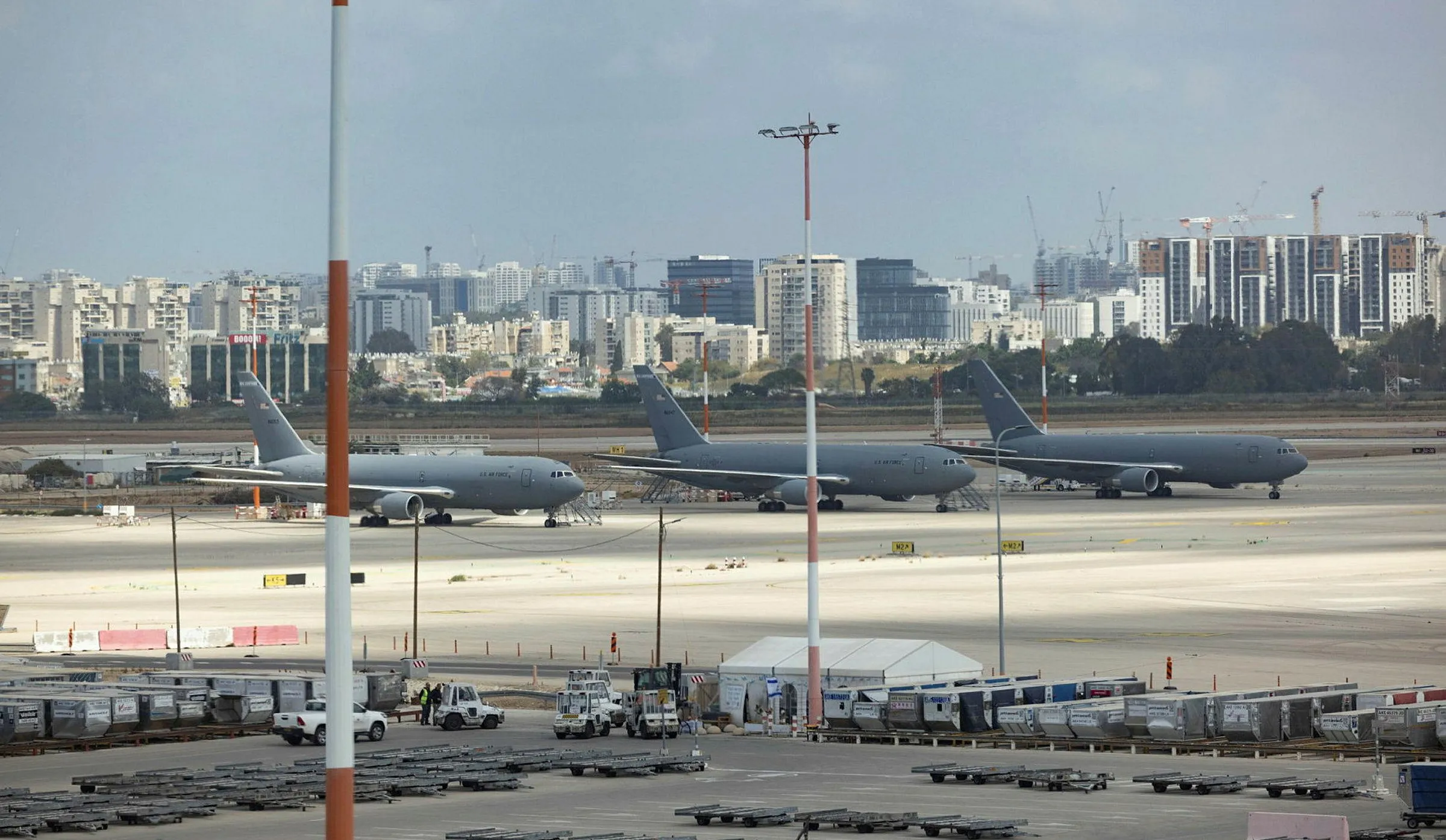 A wide view of Ben-Gurion International Airport showing terminal areas and apron space with multiple aircraft parked