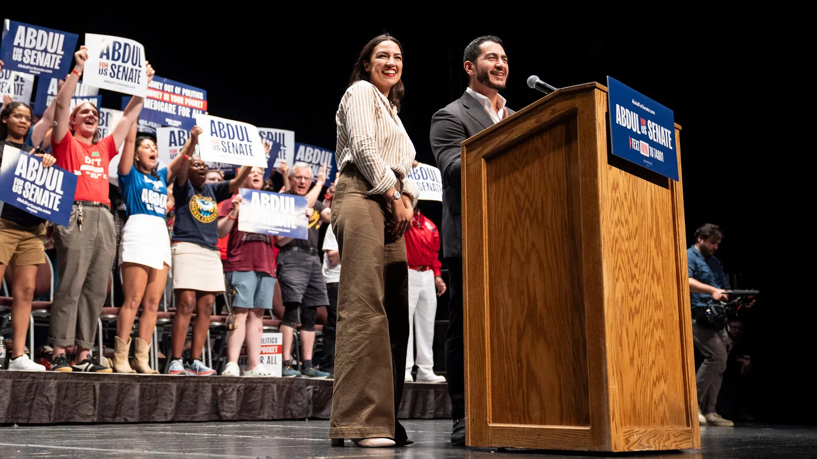 Abdul El-Sayed speaking alongside Rep. Alexandria Ocasio-Cortez at a town hall stop in Iron Mountain, Michigan