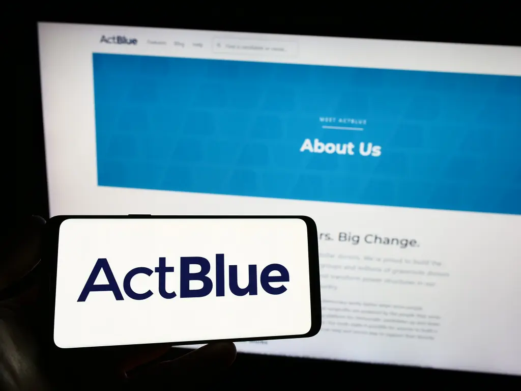 An ActBlue sign displayed at a public political event