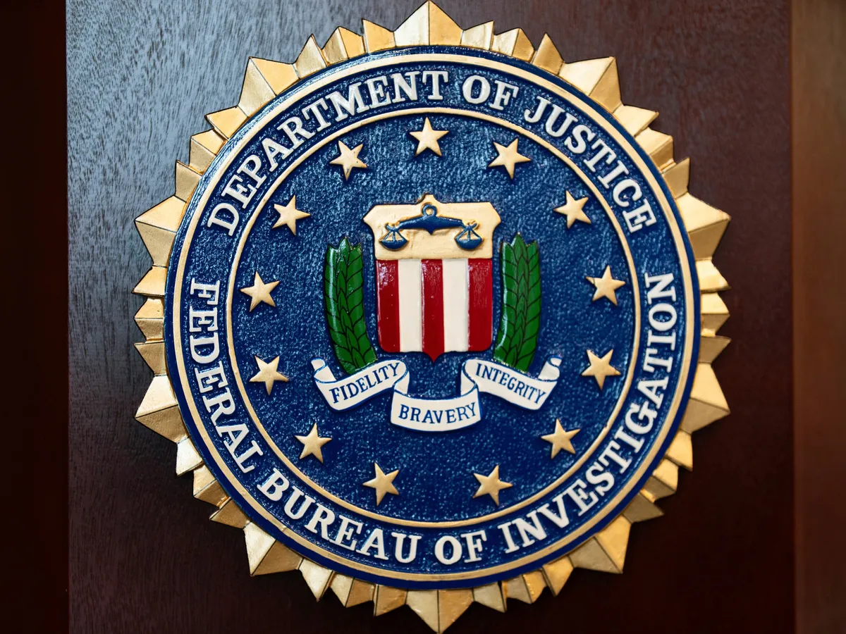An FBI seal displayed on a wall at an FBI facility.