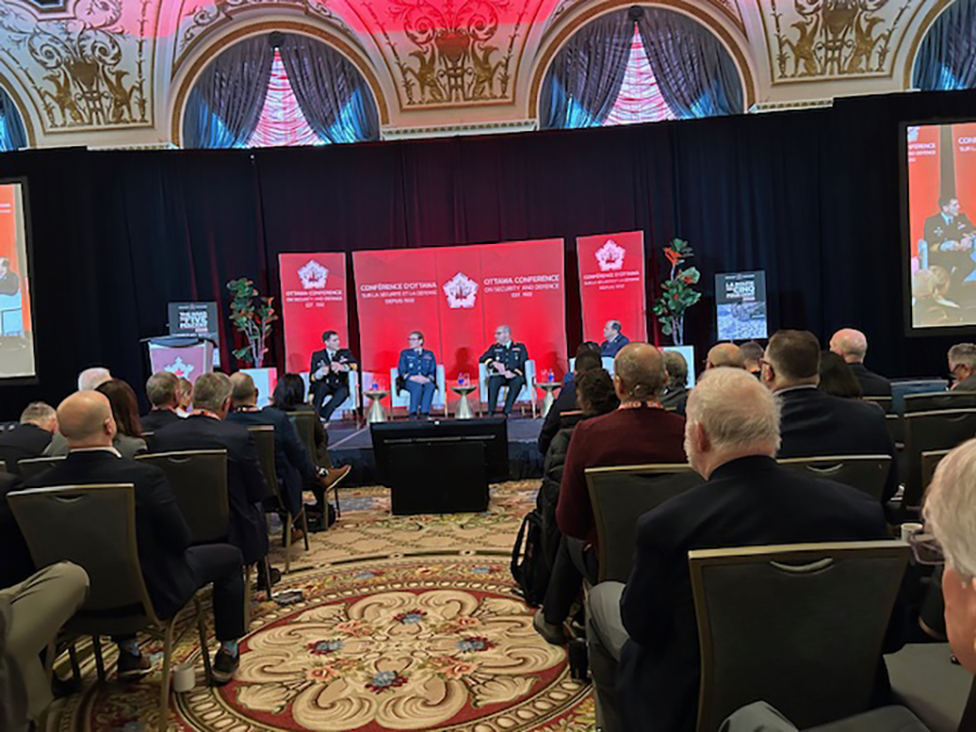 Canadian federal government buildings in Ottawa with visible security presence and officers near an entrance, news photography style