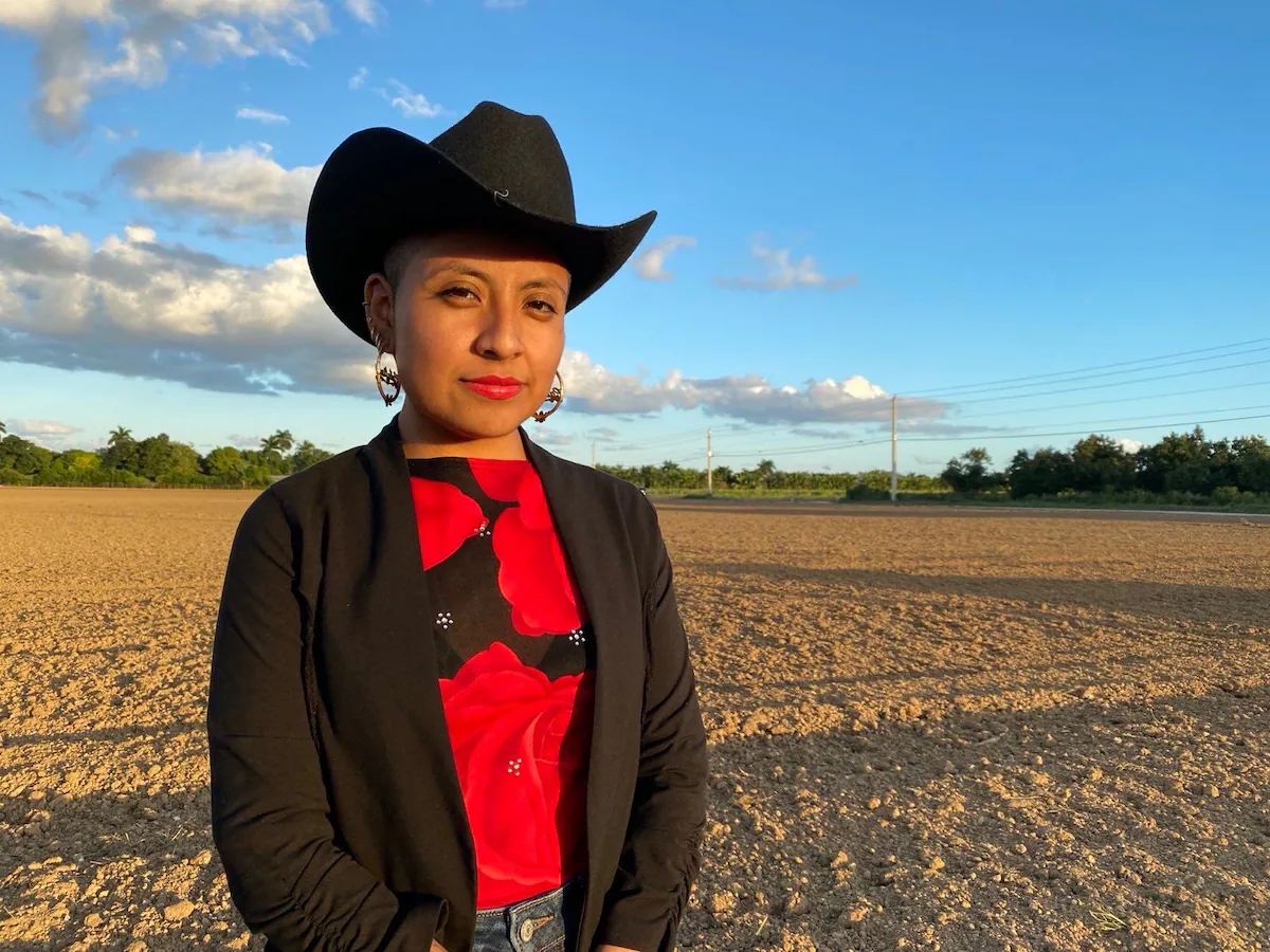 Catalina 'Xóchitl' Santiago walking with her attorney outside an immigration court building, documentary news photograph style