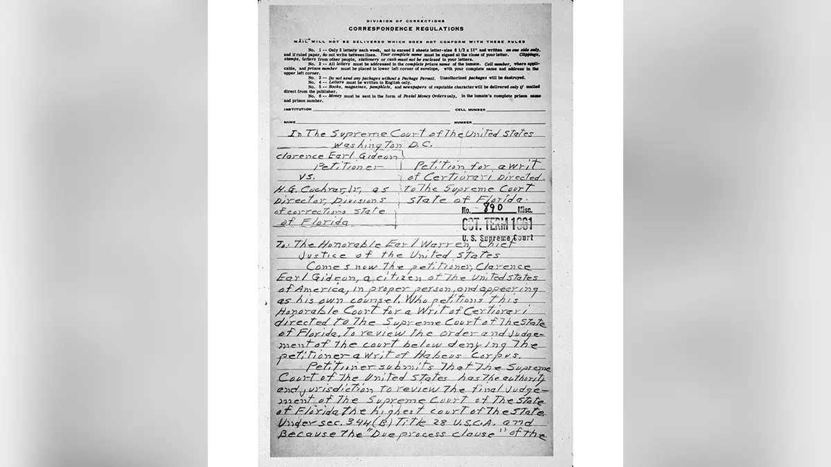 Clarence Earl Gideon seated at a prison desk writing by hand on paper under a dim overhead light, realistic documentary photography style