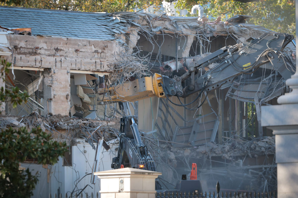 Demolition work at the White House site where the East Wing stood, viewed from a distant vantage point in Washington, D.C., news photography style