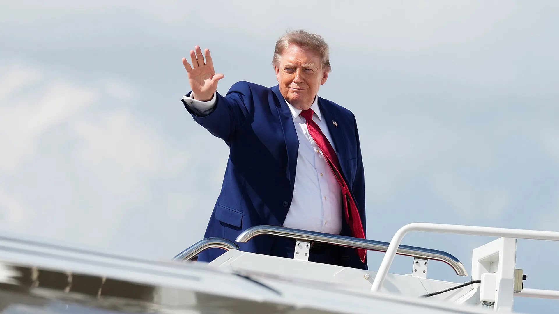Donald Trump speaking to reporters outdoors at Joint Base Andrews in Maryland