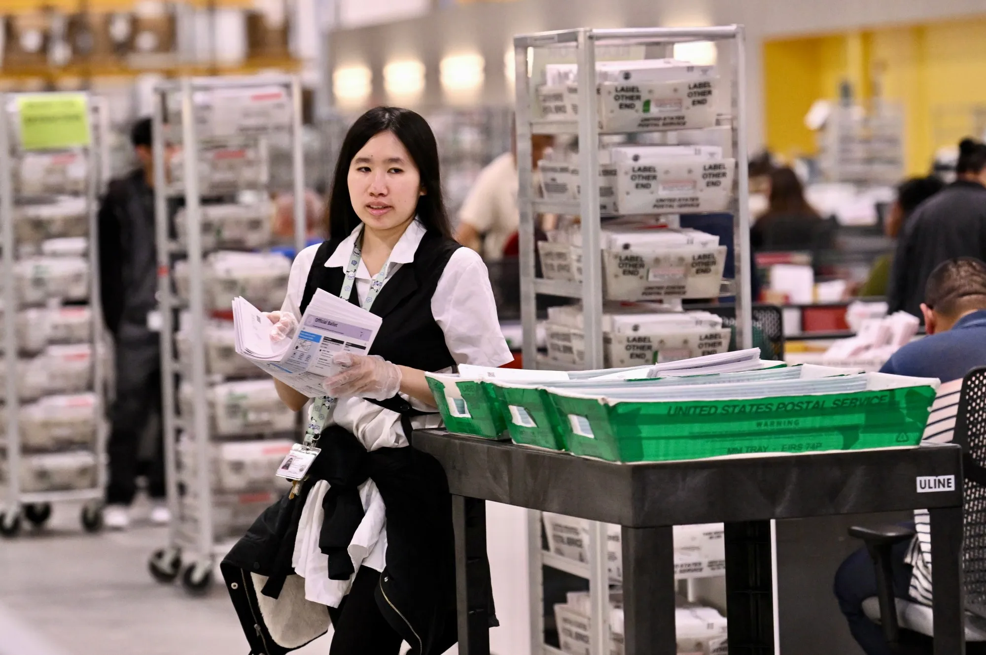 Election workers processing ballots at the Los Angeles County Registrar-Recorder