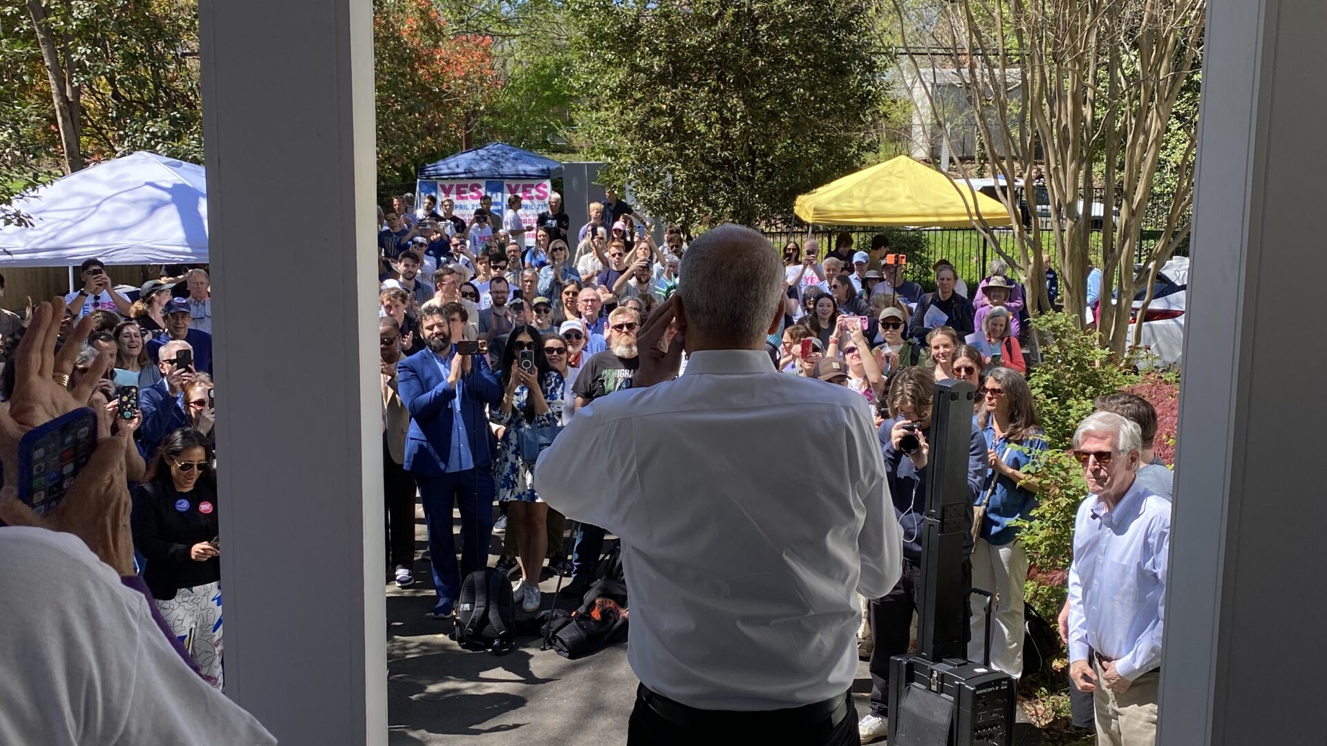 Eric Holder seated in a studio chair during a televised interview in Washington, D.C., April 2026, news photography style