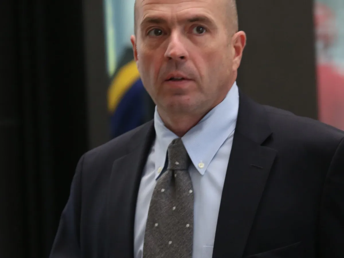 Federal judge Jorge Alonso seated at the bench in a Chicago federal courtroom during a 2026 proceeding, courtroom lighting, news photography style