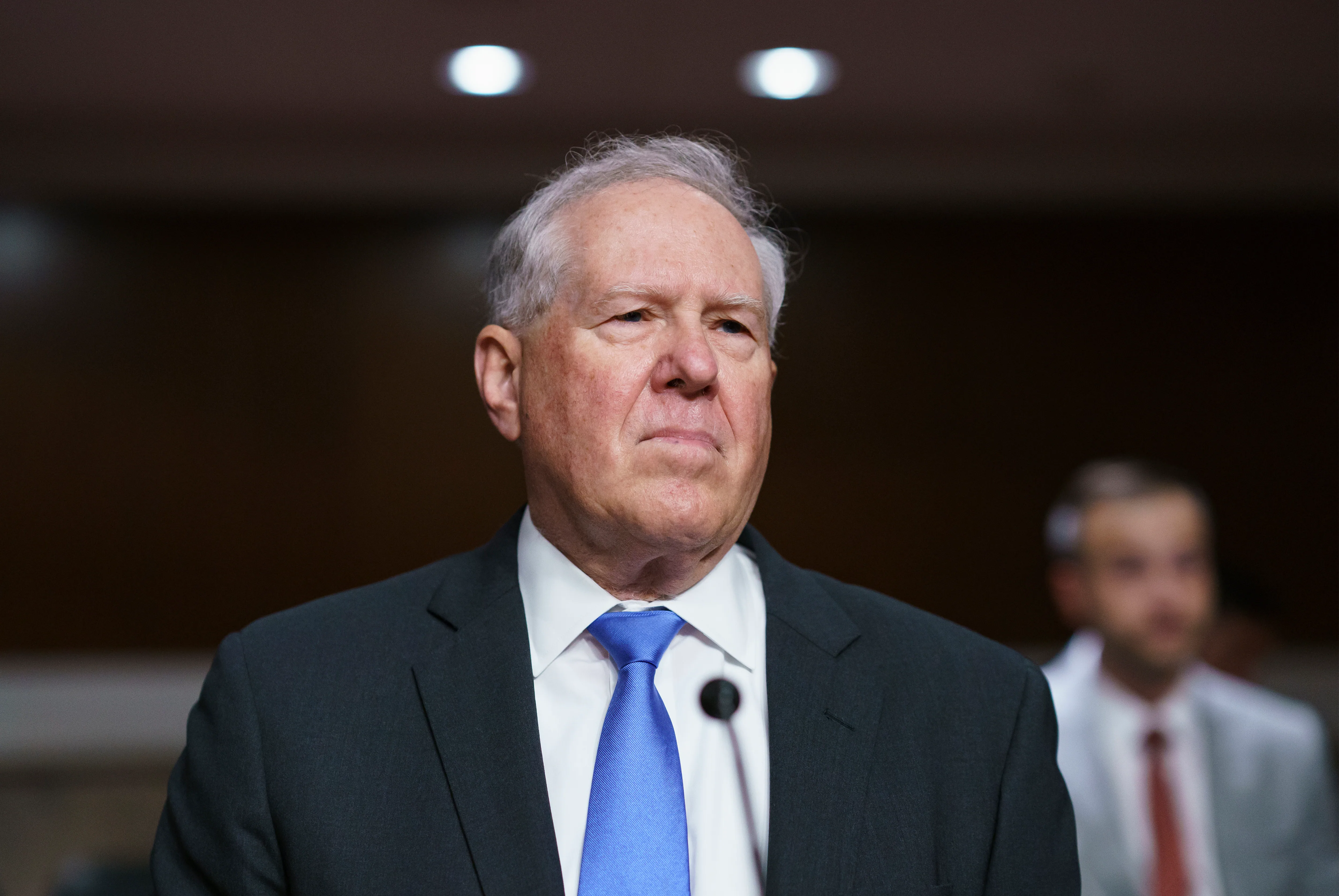 Frank Kendall, former Secretary of the Air Force, speaking at a Senate hearing table with microphones and a nameplate visible