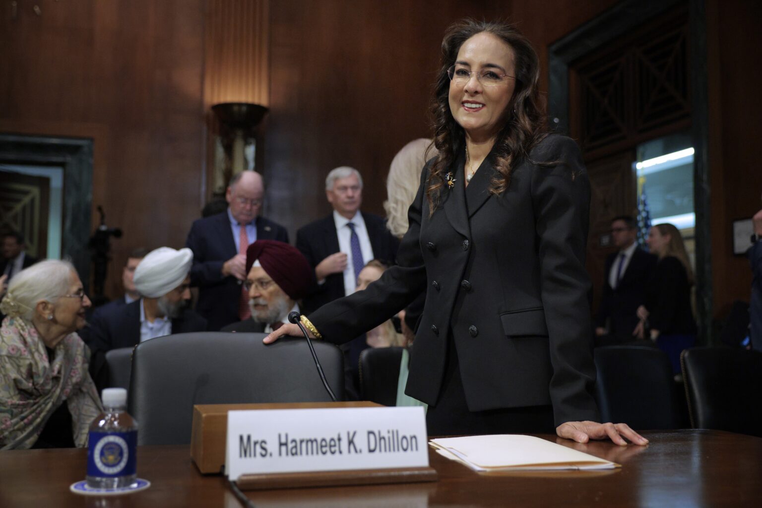 Harmeet Dhillon arriving at the U.S. Department of Justice for a press conference in Washington, D.C., news photography style
