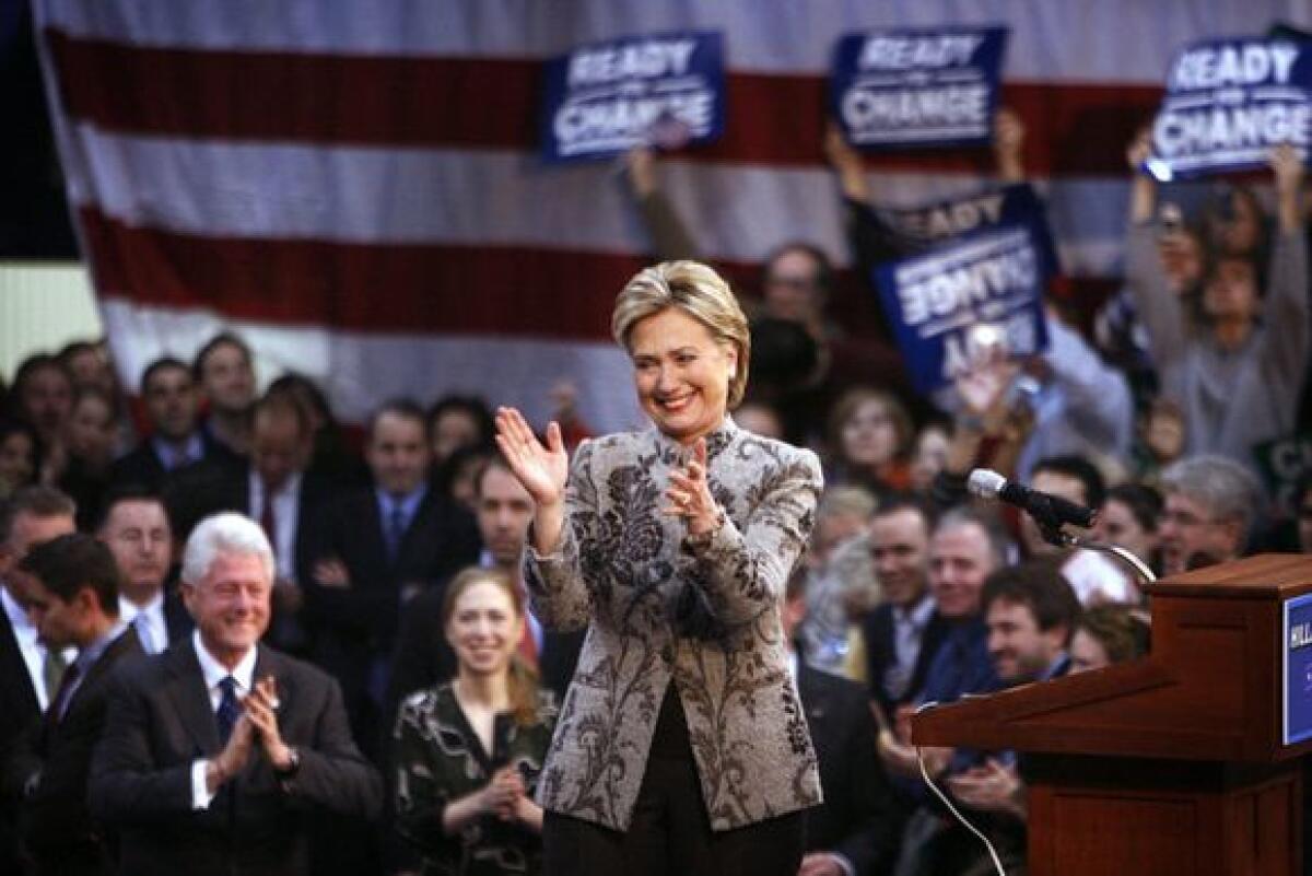 Hillary Clinton speaking at a 2008 campaign event in New Hampshire, standing at a podium in a crowded indoor venue, news photography style
