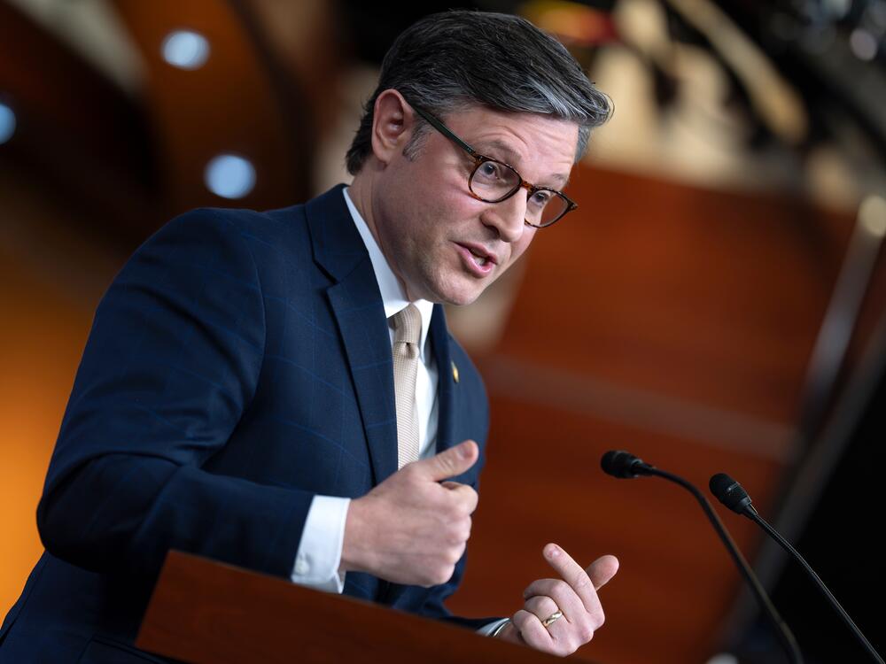 House Speaker Mike Johnson speaking to reporters during a press conference at the U.S. Capitol, news photography style