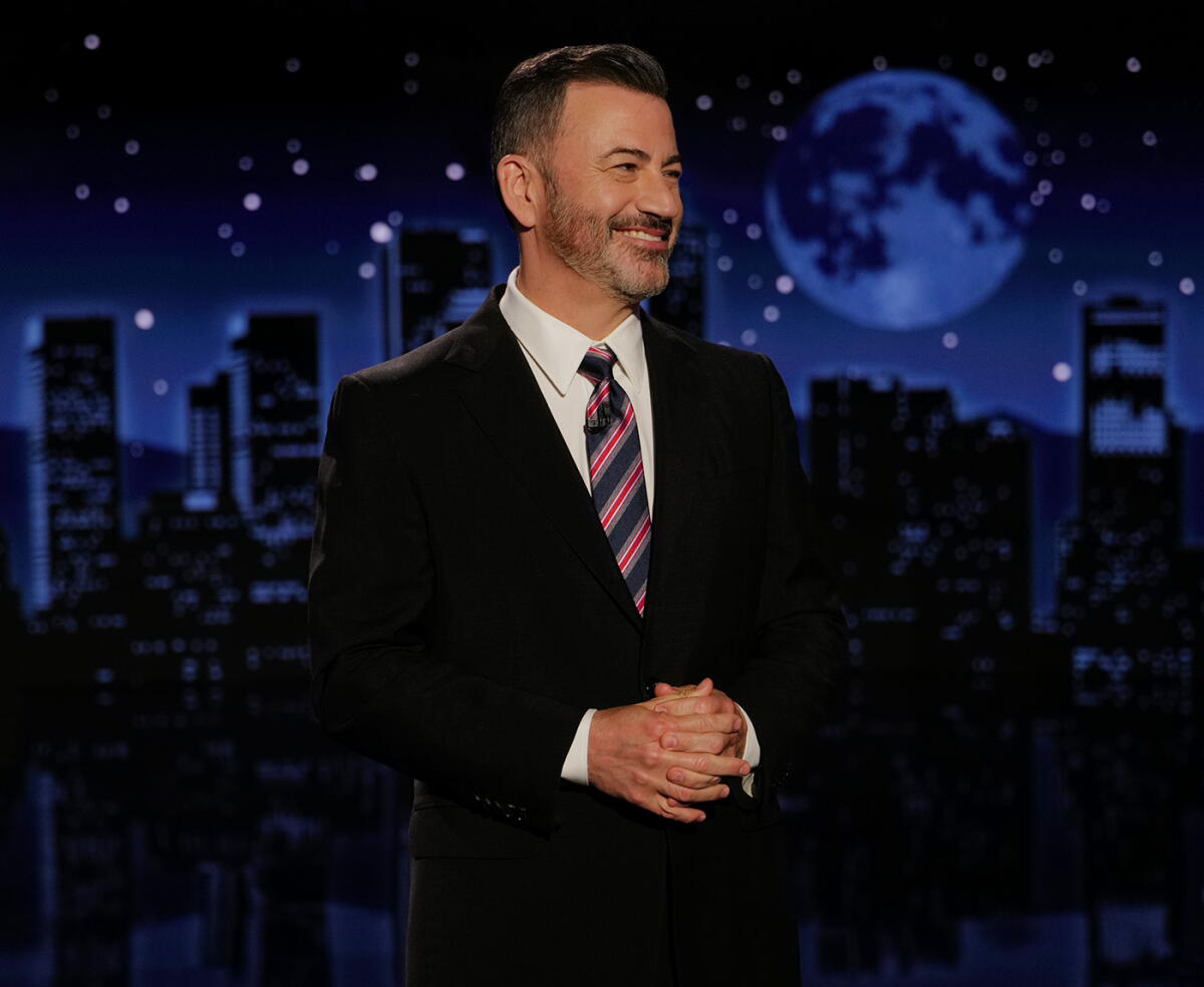 Jimmy Kimmel delivering a monologue on his late-night show stage