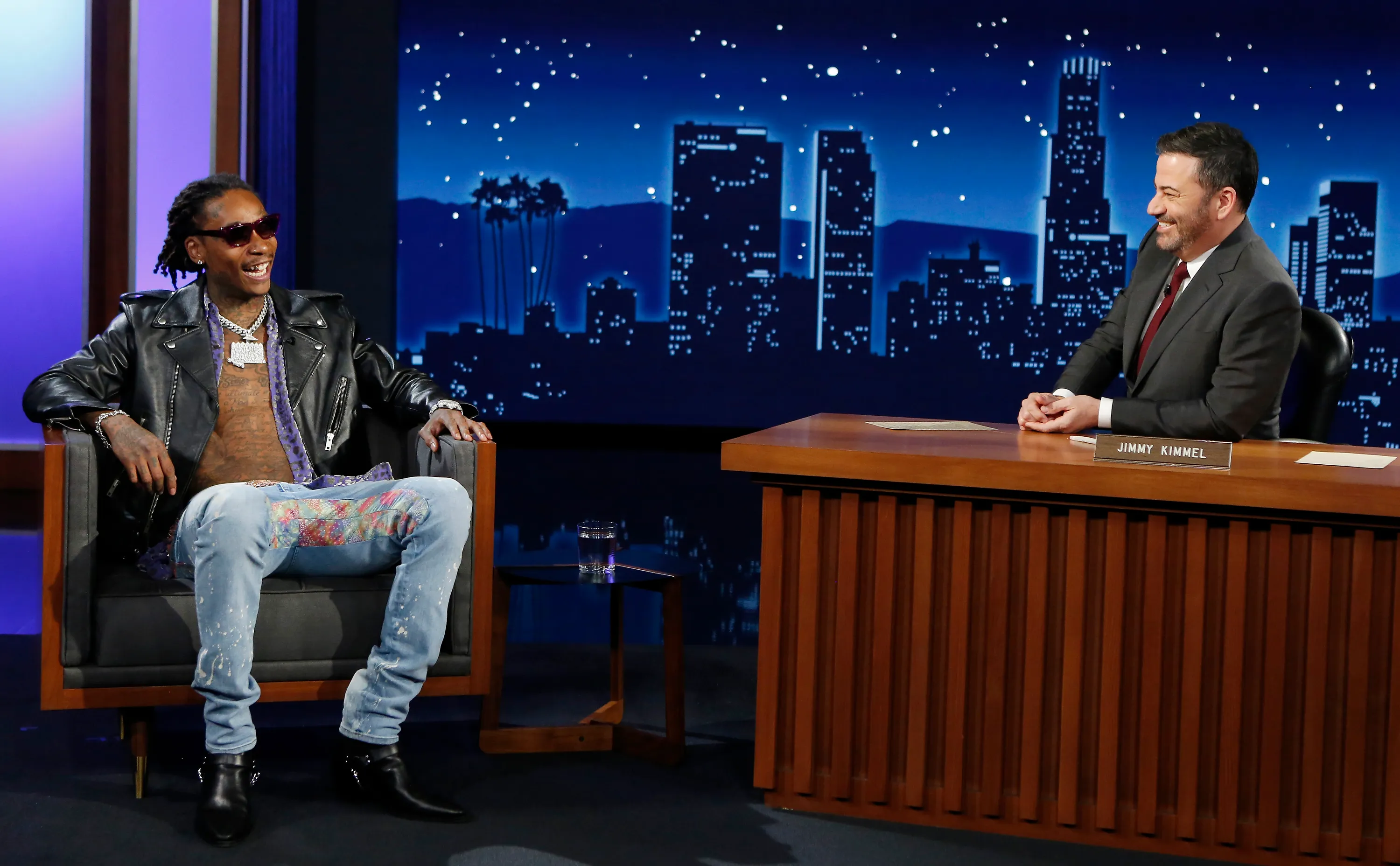 Jimmy Kimmel speaking on a late-night show set